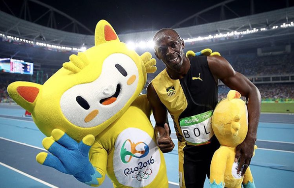 Vinicius com o corredor jamaicano Usain Bolt