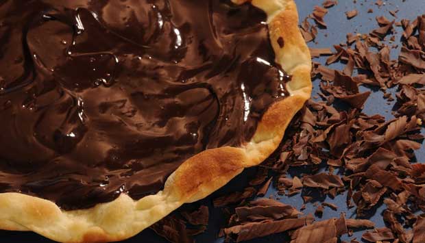 Pizza de chocolate extremamente cremosa, com creme de leite.<br> Pizza de chocolate extremamente cremosa, com creme de leite.<br>