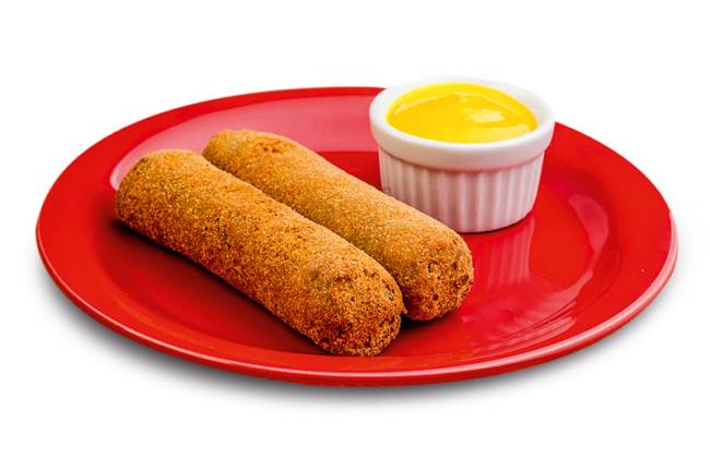 Croquete Pavelka foto Divulgação.jpg A imagem mostra dois croquetes de carne ao lado de mostarda sobre prato vermelho