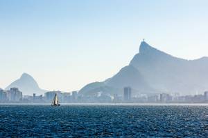 Sailing Boat Sailing in Guanabara Bay with Christ the Redeemer