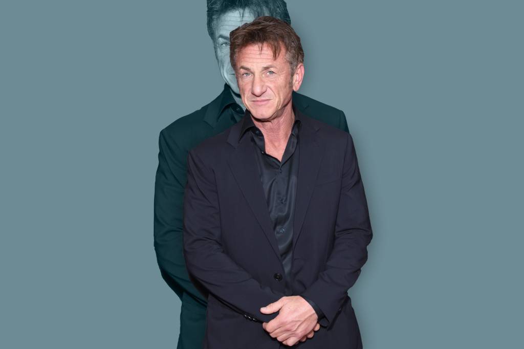 A imagem mostra o ator Sean Penn, de terno e camisa escuros