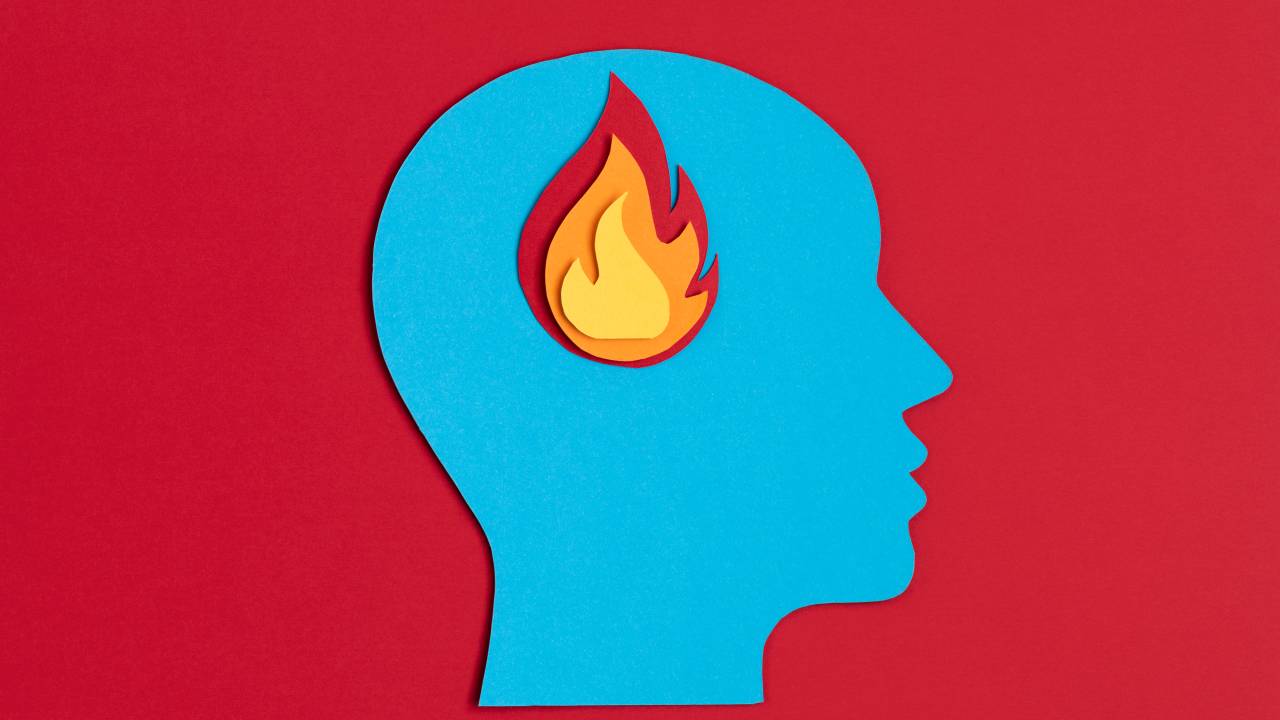 Ilustração de uma cabeça com labareda de fogo.