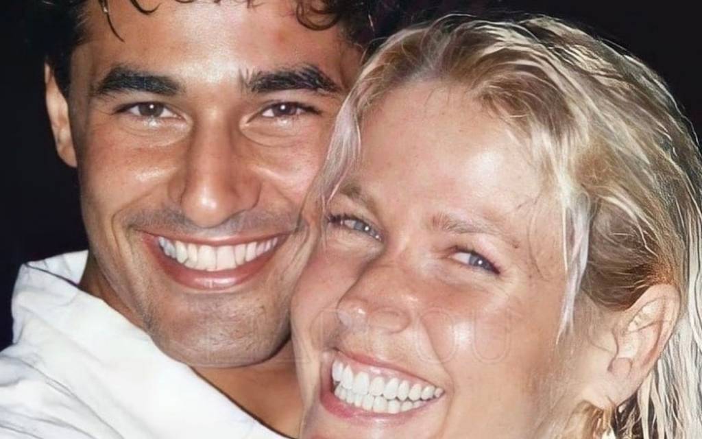 A imagem mostra Luciano Szafir e Xuxa sorrindo