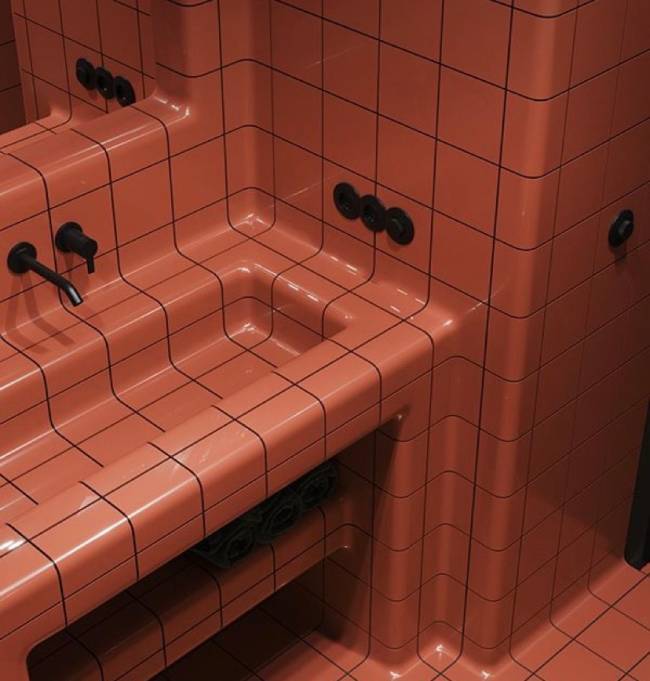Rejunte colorido A imagem mostra um banheiro com revestimento rosa e rejunte preto