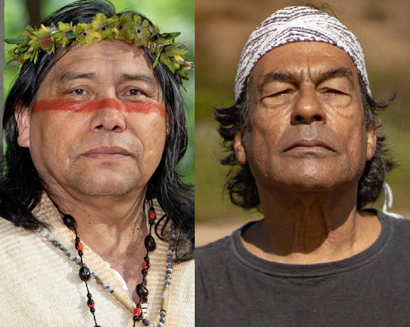 À esquerda, Daniel Munduruku, indígena com cabelos pretos e lisos, com tinta com de terra abaixo dos olhos e folhagens na cabeça, usando blusa bege e colar de sementes. À direita, Ailton Krenak, indígena de cabelos grisalhos ondulados, com faixa branca estampada na cabeça e blusa cinza.