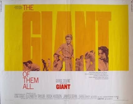 Cartaz do filme Giant com título em letras grandes amarelas. Abaixo, várias pessoas em tons sépia, incluindo um homem alto de camisa clara e calça escura, e uma mulher com cabelo escuro e expressão séria. O texto OF THEM ALL e os nomes dos atores Elizabeth Taylor, Rock Hudson e James Dean aparecem na parte inferior